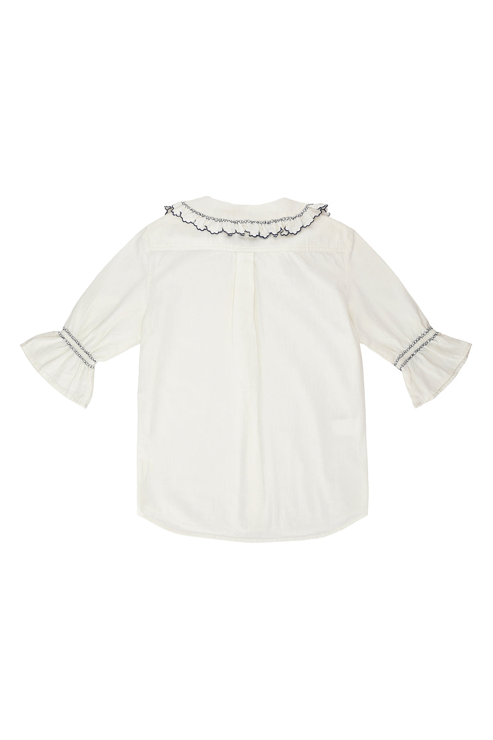 A white organic cotton blouse with dark blue embroiderery on frilled sleeves and a frill peek-a-boo collar on a white background