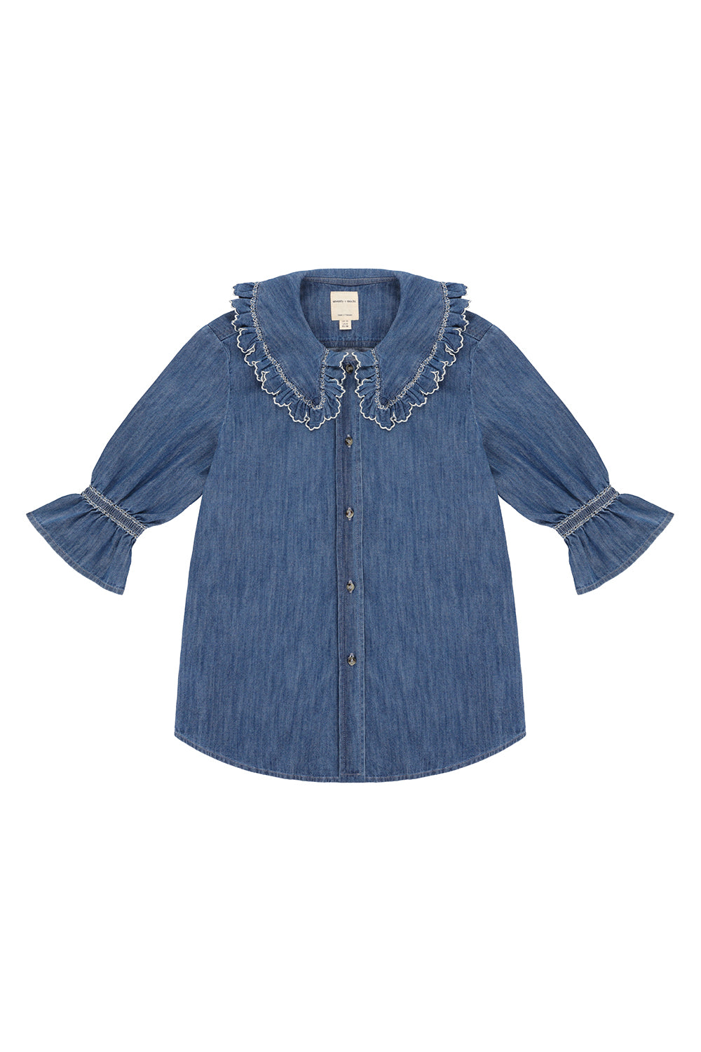 an indigo denim blouse with white embroidery frill on the collar and sleeves on a white background