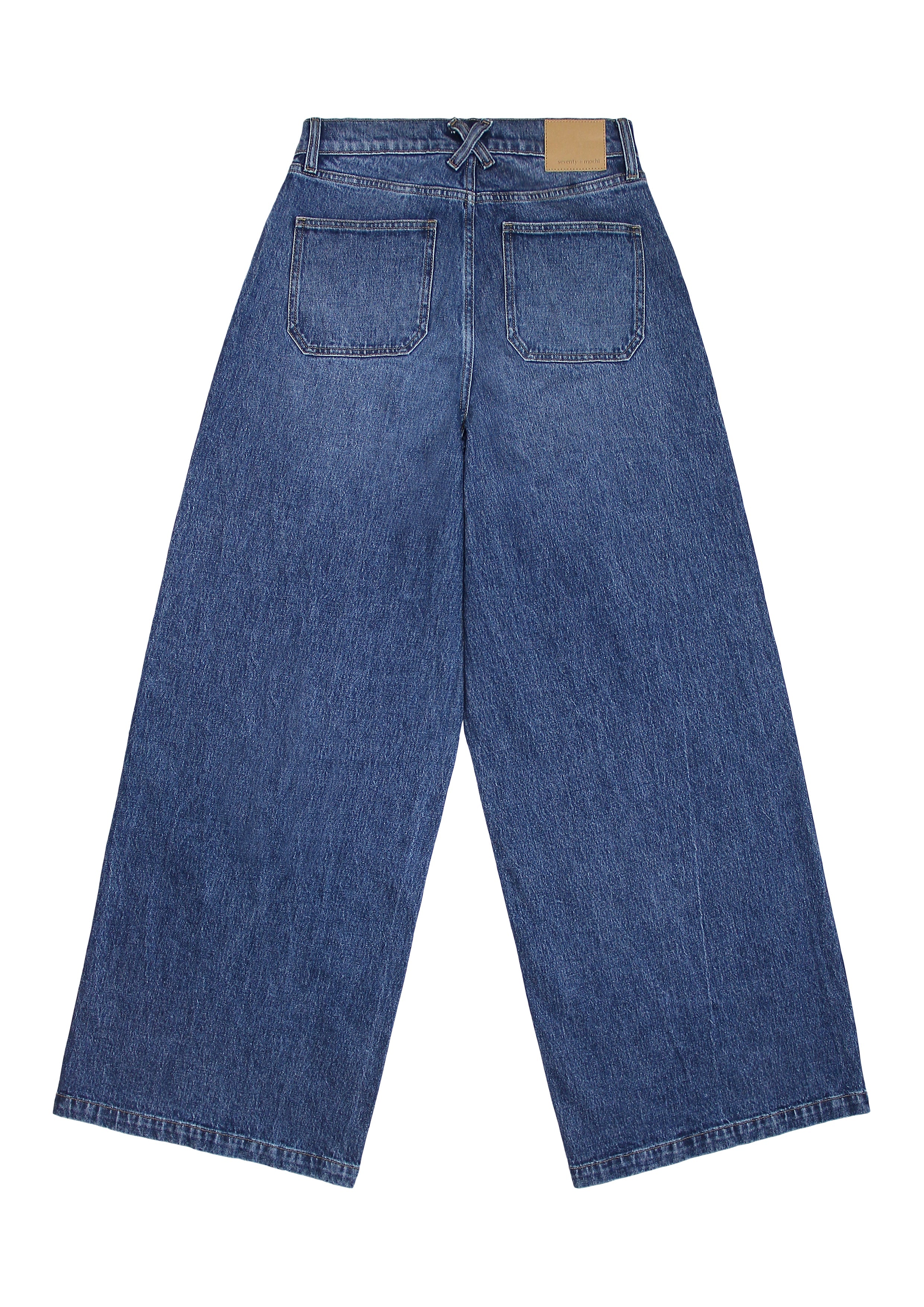 Blue wide leg jeans on a white background